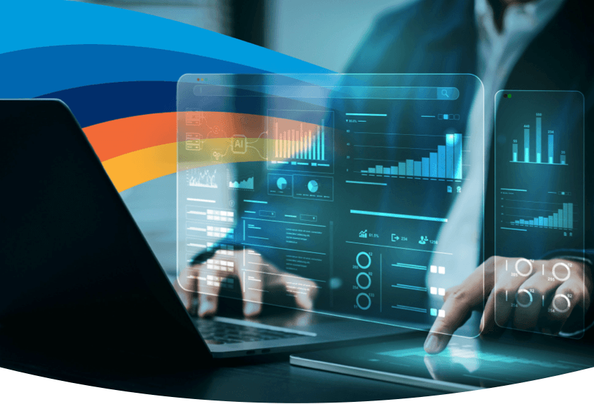 a man is using a laptop and a tablet while looking at graphs