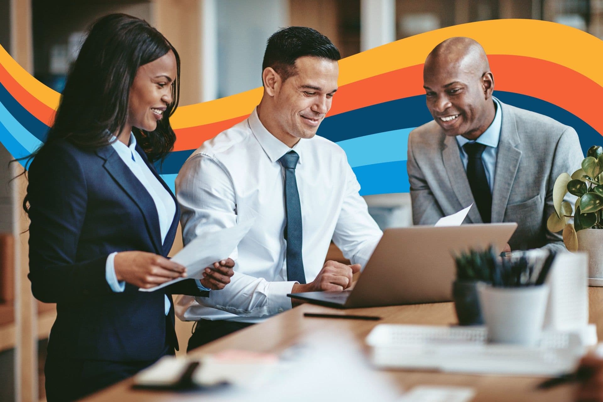 a group of business people are looking at a laptop computer .